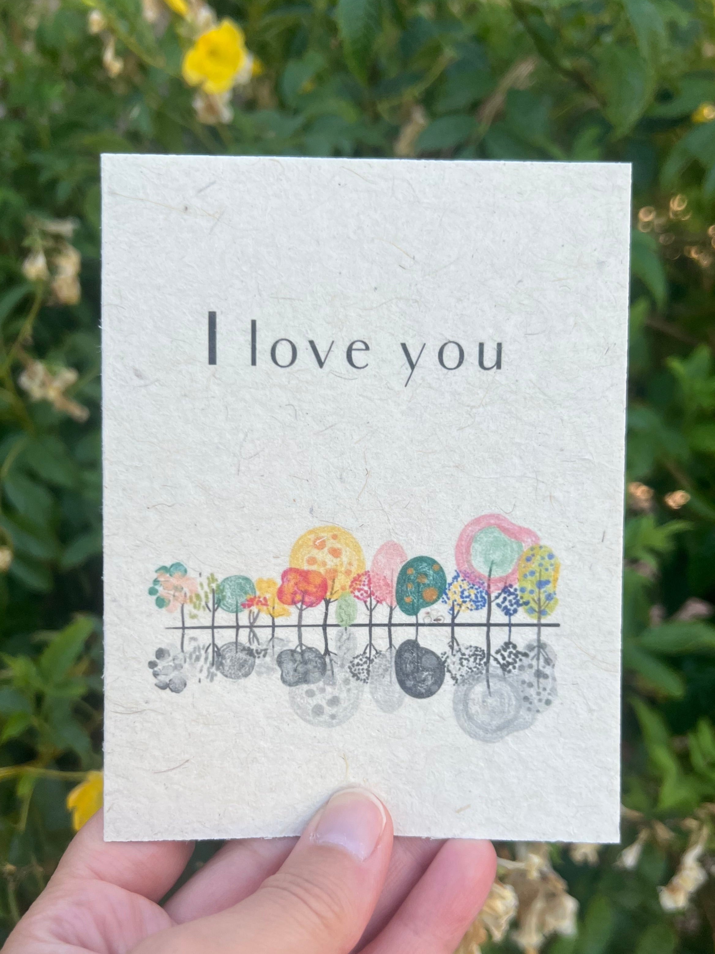 seed paper tree free eco friendly greeting card with beautiful trees with reflection saying I Love You