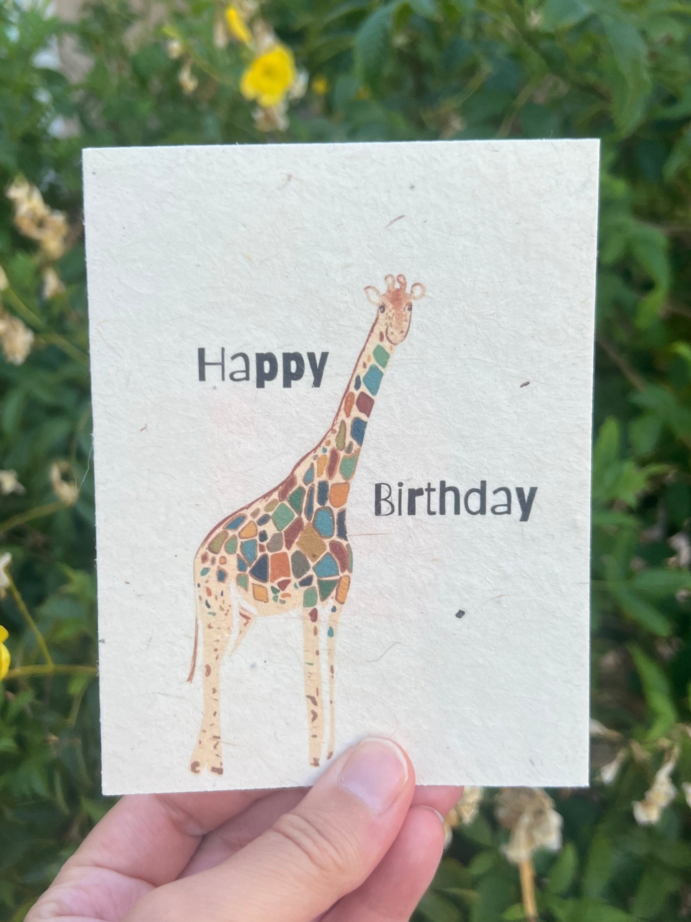 plantable greeting card with colorful giraffe on it