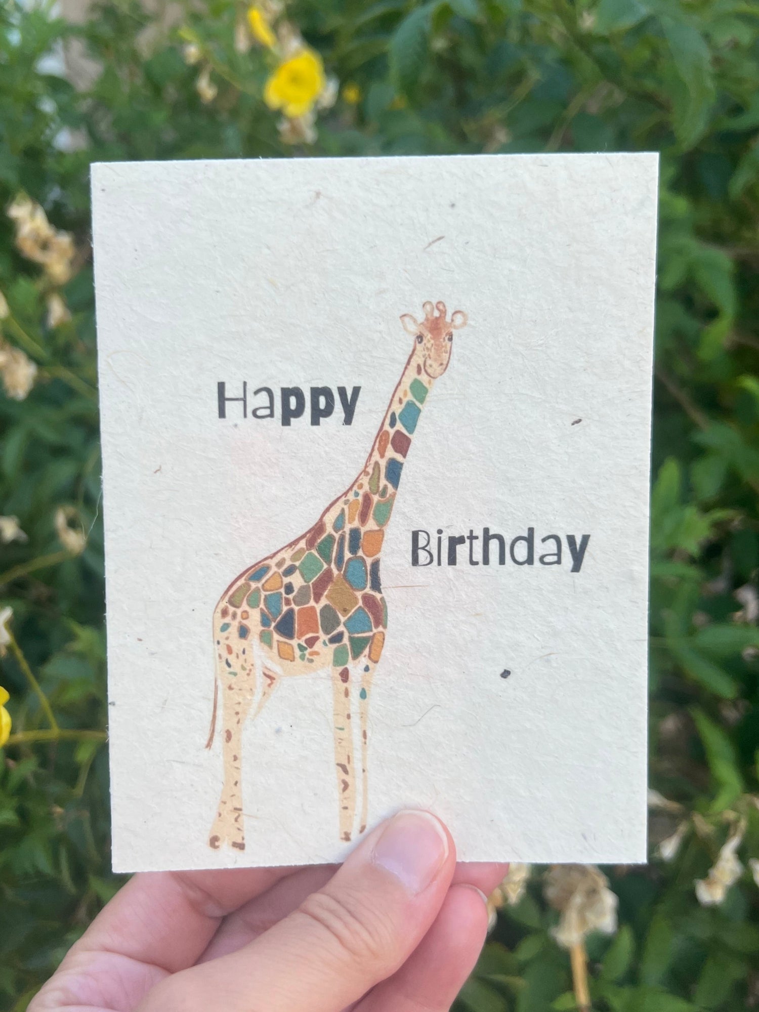 plantable greeting card with colorful giraffe on it