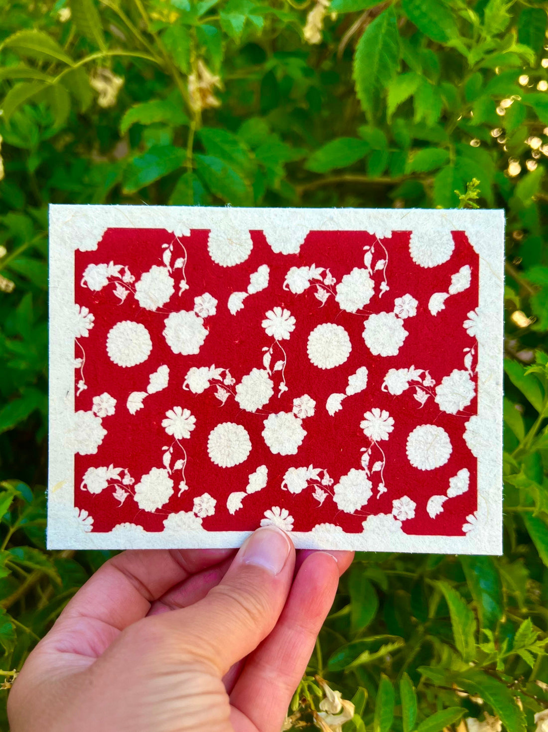 cherry red floral design with cream flowers on seed paper greeting card