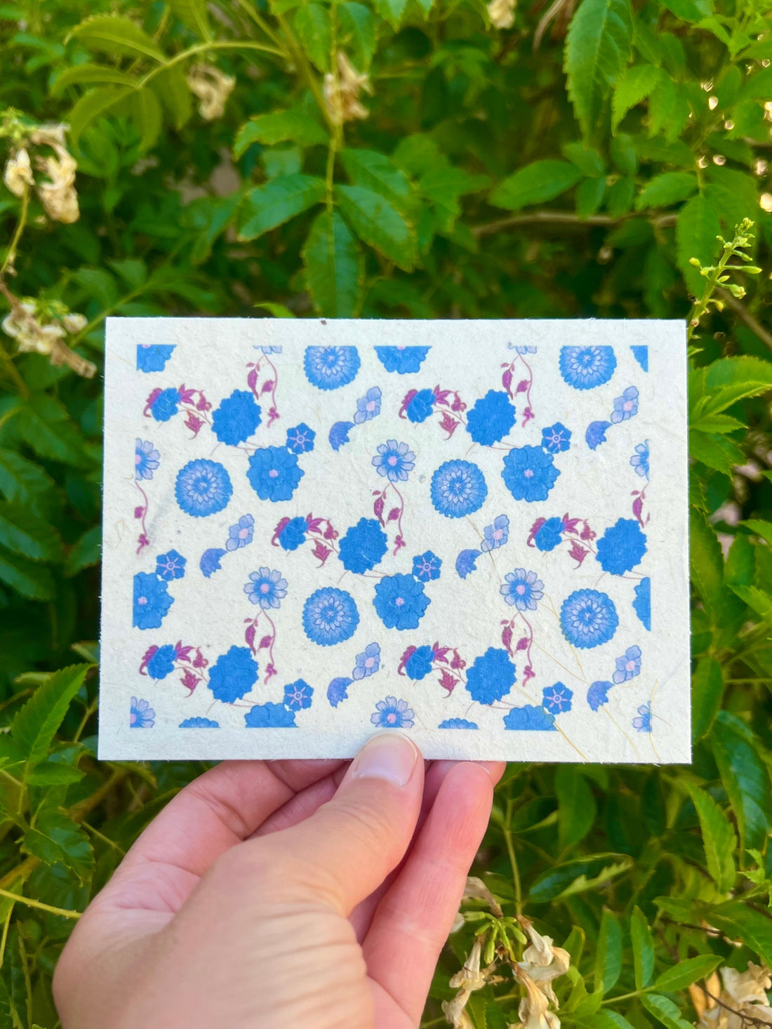 hand drawn sky blue and periwinkle blue flowers on seed paper greeting card