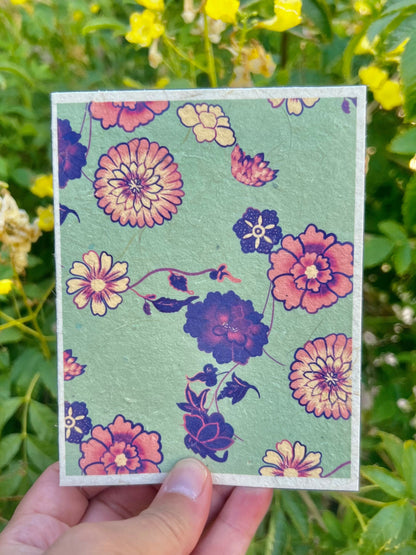 mint green with pink and purple flowers on a plantable seed paper greeting card